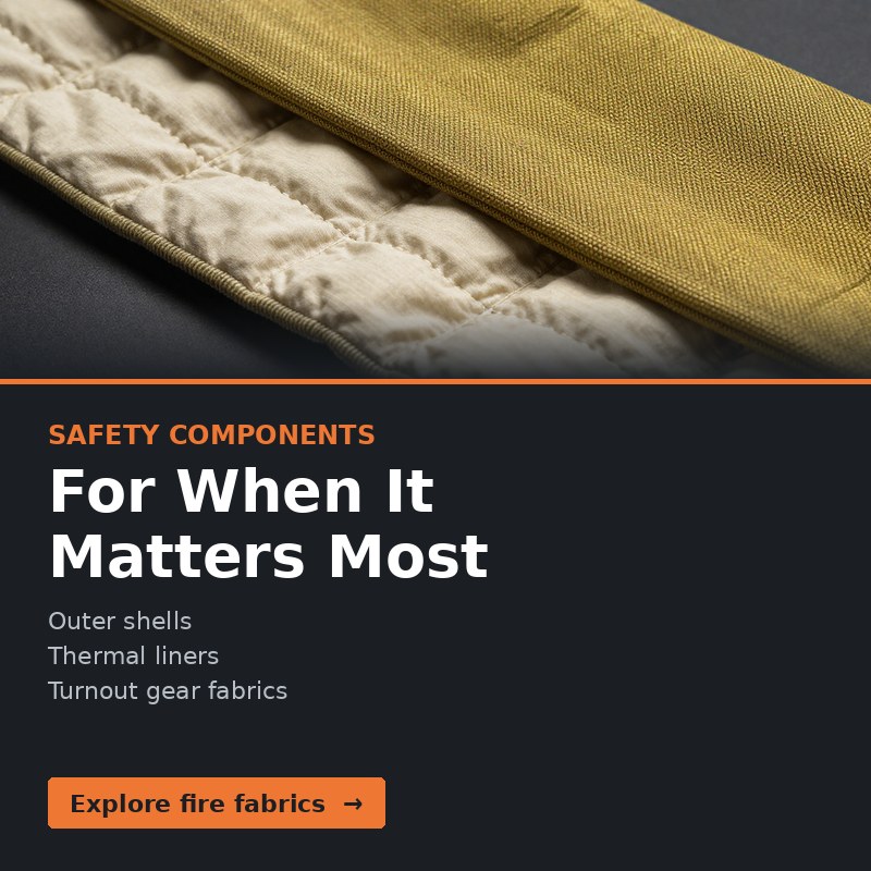A woven aramid outer shell fabric overlapping a quilted thermal liner.